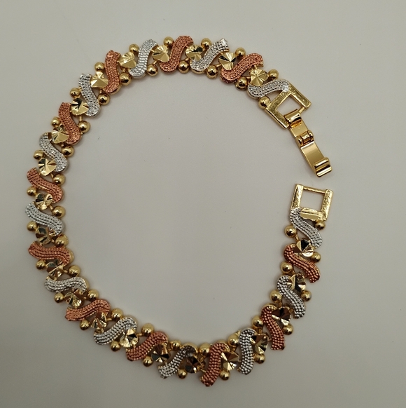 Elegant Gold, Silver, and Rose Gold Bracelet - Picture 1 of 7